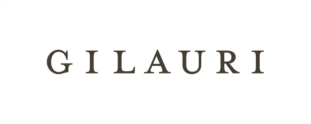 The image displays the word "GILAURI" in bold, uppercase serif letters centered on a white background, evoking the elegance of Kakheti wine labels and Saperavi’s rich tradition.